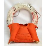 An R.M.S. Queen Elizabeth life jacket inscribed "BT, 3 3 1966 R.A.B.