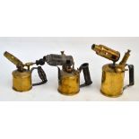 Three late 19th century brass blow lamps to include a "Primus" example, a small iron shoe last,