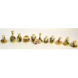 A collection of Locke & Co Worcester blush ivory miniature vessels of various shapes and sizes,