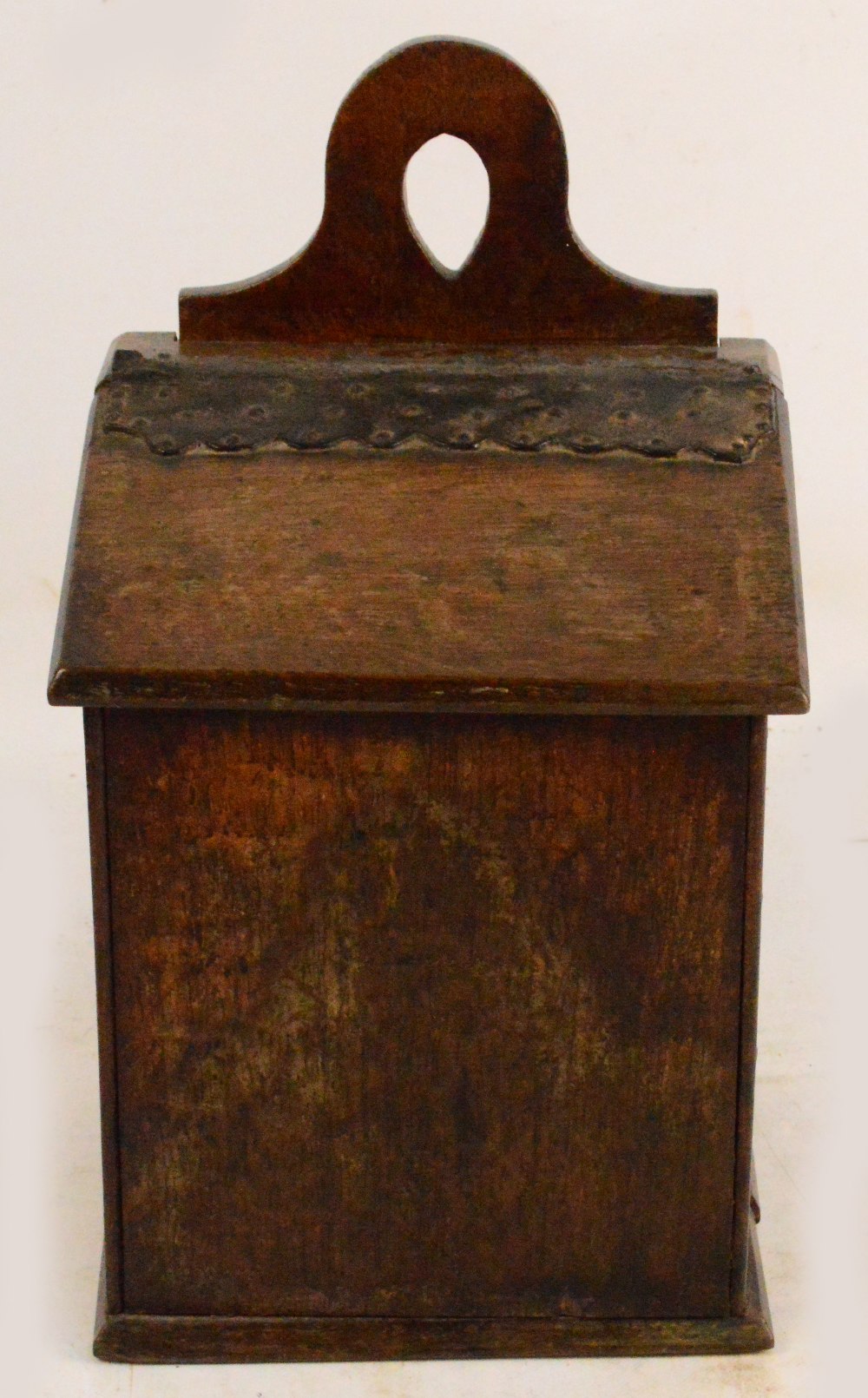 A mid 19th century Welsh oak salt box, with shaped back plate,