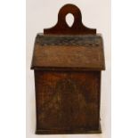 A mid 19th century Welsh oak salt box, with shaped back plate,