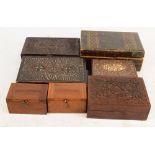 A collection of seven trinket boxes including a pine simulated strap inlaid example,