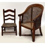 A Victorian caned child's tub chair, possibly the top of a high chair, height 56cm,