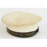 A naval cap with band inscribed "Commander-in-Chief", width of inside rim, 20cm.