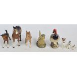 Three Beswick figures; model 1197 "Brown Pony", a brown outstretched foal and a donkey foal,