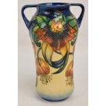 A modern Moorcroft twin handled vase in "Anna Lily" pattern by Nicola Slaney, height 25.