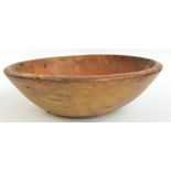 A 19th century sycamore dairy bowl, diameter 47cm. CONDITION REPORT: Several dents, scratches and