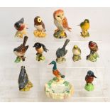 A group of Beswick bird figures including "Owl", no.2026, "Whitethroat", no.2106, "Stonechat", no.