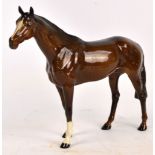 A large Beswick brown glazed model of a horse.