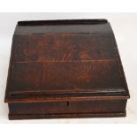 A George III oak bible box, the sloping hinged front enclosing an interior with four short drawers,