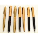 A Parker rolled gold pen with engine turned decoration, two further Parker pens, two fountain pens