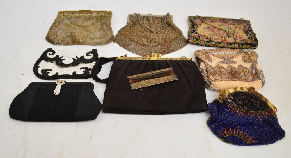 A collection of vintage evening bags including a mesh chain example, a tapestry example,
