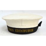 A vintage sailor's cap with band inscribed "H.M.S. Edinburgh", internal diameter approx 19cm.