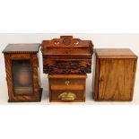 Two oak smoker's cabinets, one with glazed door, height 28cm, both enclosing a pipe rack,