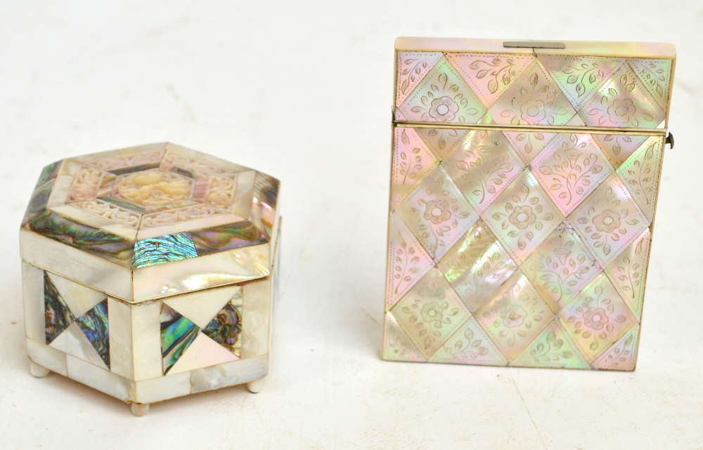 A Victorian mother of pearl card case of rectangular form with floral decoration etched to each