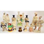A quantity of Staffordshire ceramics including flat back figural models of Scotsmen and others,