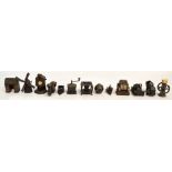 A collection of twelve metal pencil sharpeners including examples in the form of a bureau,