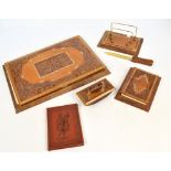 An embossed leather desk set comprising large blotting writing pad, a paper knife, stationery rack,