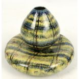 A Cobridge stoneware vase of ovoid form decorated in shades of green yellow and blue,