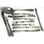 A set of five George VII hallmarked silver handle dessert knives and forks and a white metal