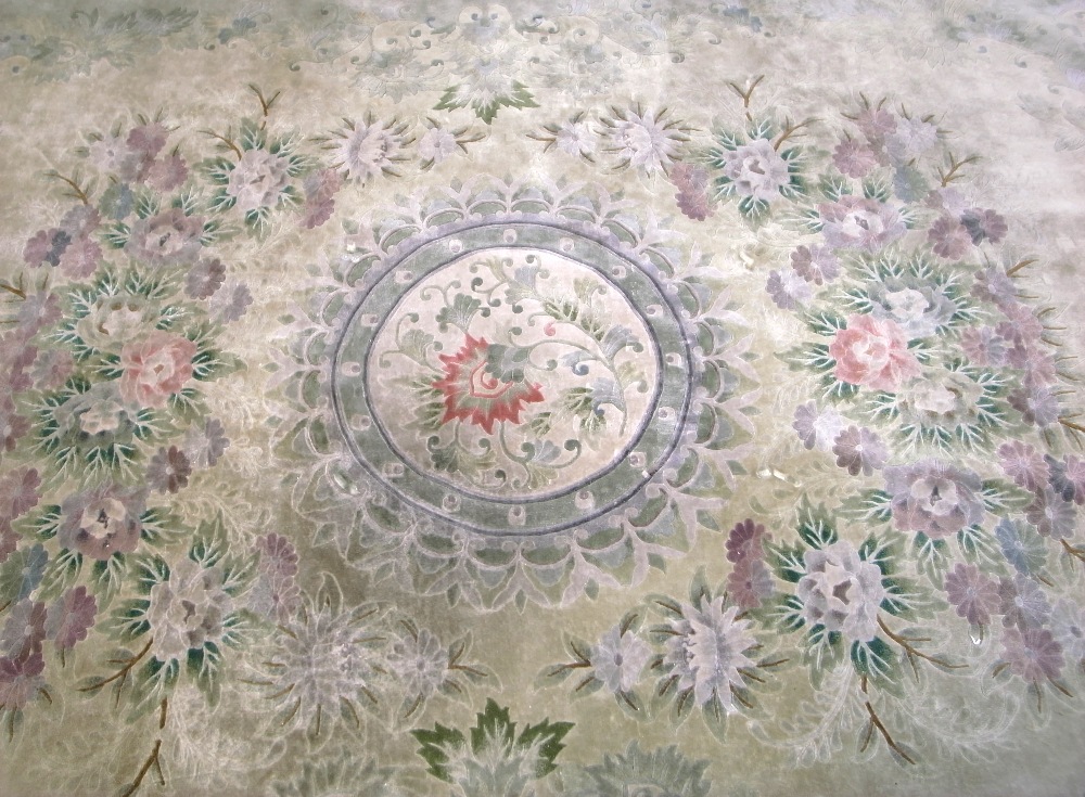 A green ground silk carpet, approx 365 x 274cm.