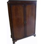 A walnut Waring and Gillow two door gentlemans wardrobe, 117 x 119cm.