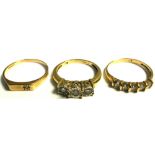 A 9ct gold three stone illusion set diamond ring, size M and two other 9ct gold rings (3).