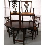 A Victorian mahogany dining table on gateleg base and two Hepplewhite style dining chairs and two