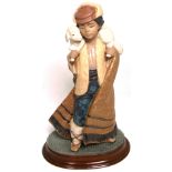 A Lladro figurine, 12163,  "Mountain Shepherd", height 24cm, with original base and box. CONDITION