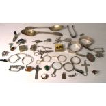 A quantity of hallmarked silver and white metal items to include two hallmarked silver bangles,