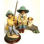 A Lladro figure group of a fisherman and his dog on a bridge, width 34cm and a standing figure