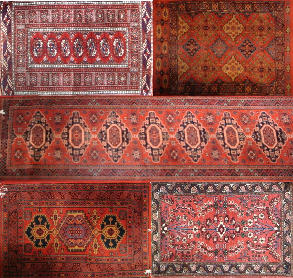 Five various red ground carpets/runners (5).