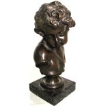 G. Moreau; a 20th century bronze bust of a young boy on a marble base, height 25cm.