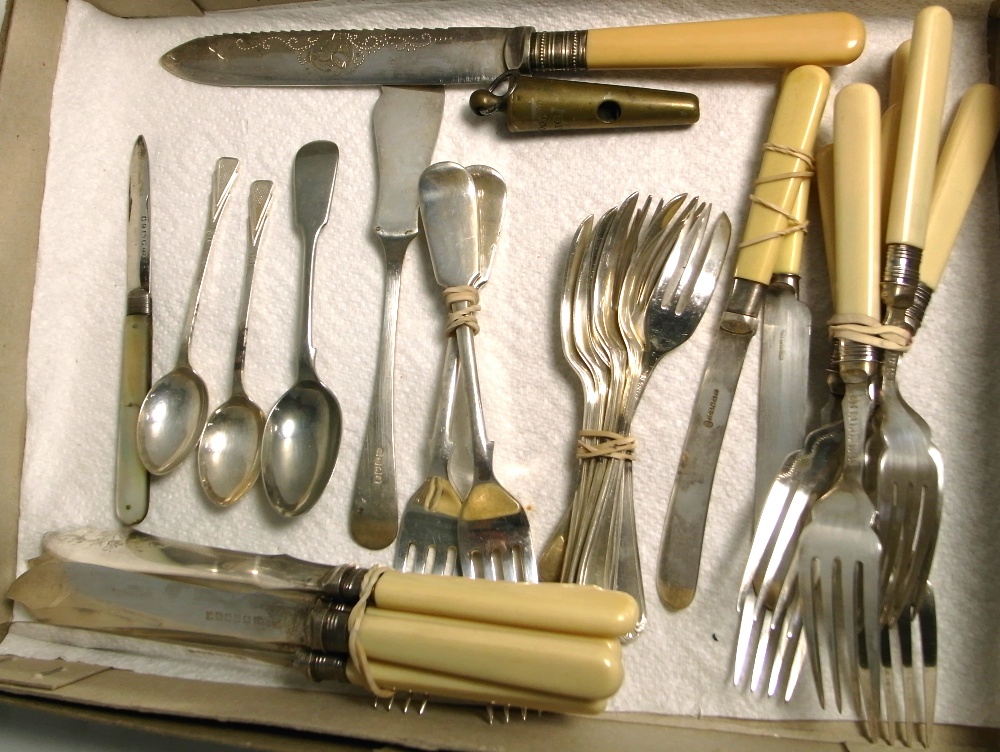 A small quantity of plated flatware with silver collars to the knives, a Liverpool police whistle,