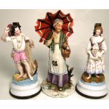 Two late 19th century Continental figurines, probably German, both on rounded bases and converted to