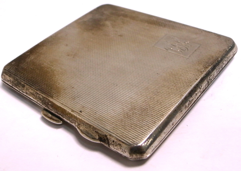 A George V hallmarked silver cigarette case, Birmingham 1935, with engraved initials to front,