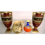 A pair of urn shaped vases, maroon ground and duck egg blue gilt heightened, blue beehive mark to