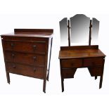 A 20th century three drawer oak chest of drawers on block supports,