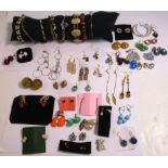 A quantity of mid 20th century costume jewellery to include brooches, rings, pendants etc.