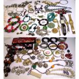 A quantity of costume jewellery to include coral and amethyst necklaces.