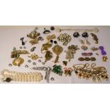 A small quantity of costume jewellery to a jewellery box to include brooches,