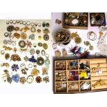 A quantity of costume jewellery to include brooches, earrings, rings etc.