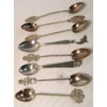 A cased set of six teaspoons with wrythen handles and various finials to include an Indian dancing