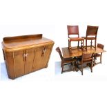 A vintage oak two door sideboard, approx length 125cm, an oak dining table and five dining chairs (