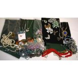 A quantity of mid 20th century costume jewellery mainly consisting of pendants and brooches.