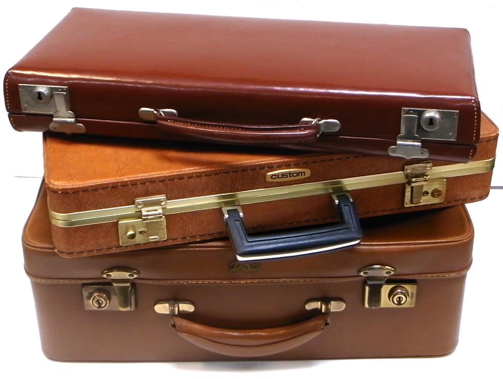 Three vintage suitcases/briefcases to include an Antler example and one initialled "J.D.C." (3).