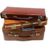Three vintage suitcases/briefcases to include an Antler example and one initialled "J.D.C." (3).