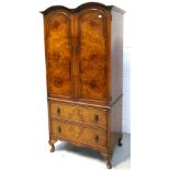 A walnut linen cupboard/cabinet arched top above twin door cupboard section to two long drawers and