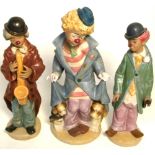 Three Lladro figurines of clowns "Surprise", "Sad Sax" and "Circus Sam", largest height 25cm, all