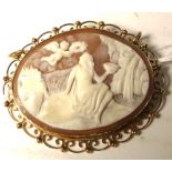 A yellow metal cameo brooch.